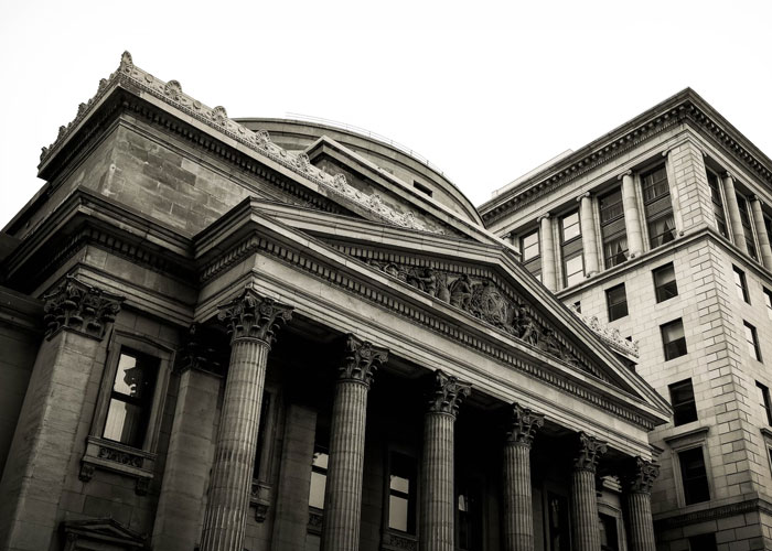 Historic office building with classical columns, symbolizing disturbing things people experienced while at work in urban settings.