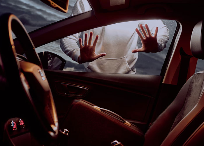 Person outside a car pressing hands on the window, illustrating disturbing things people saw and experienced while at work.