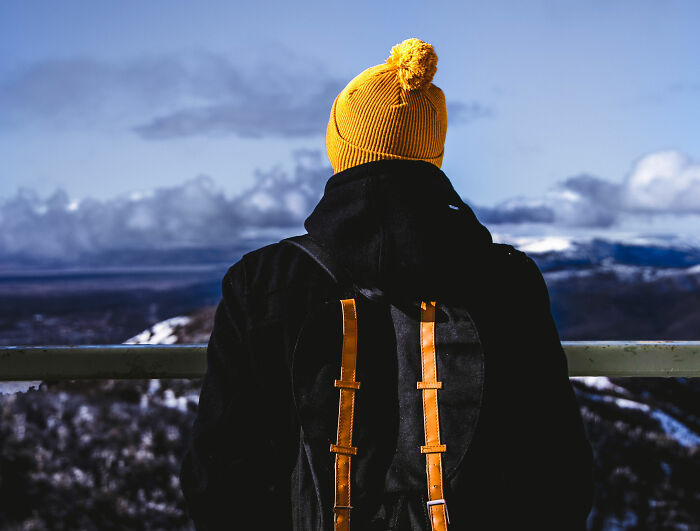 man wearing yellow hat 