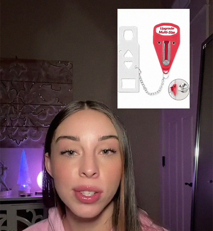 Woman explaining life-saving tips with a red multi-size door lock device against a dark room background