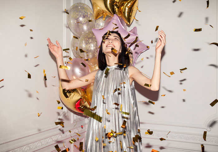 woman popping the confetti