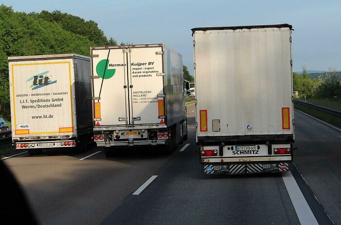 Elephant Race. The Act Of Semis Passing Each Other With Minimal Differences In Speed