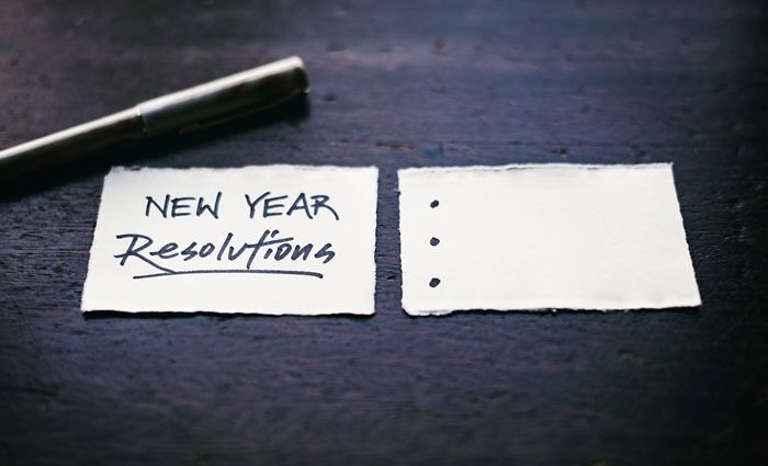 two pieces of paper with a pen nearby