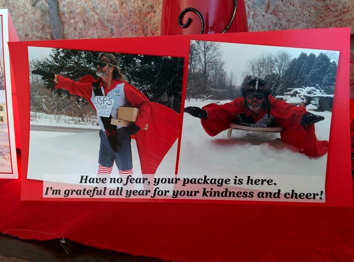 Funny Christmas card featuring a person dressed as a USPS superhero delivering packages in the snow.