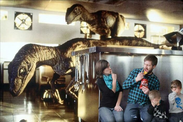 Family creating funny Christmas card with dinosaurs in a kitchen scene.