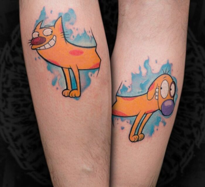 Cartoon tattoos of a whimsical orange character on two arms, inspired by animated shows.