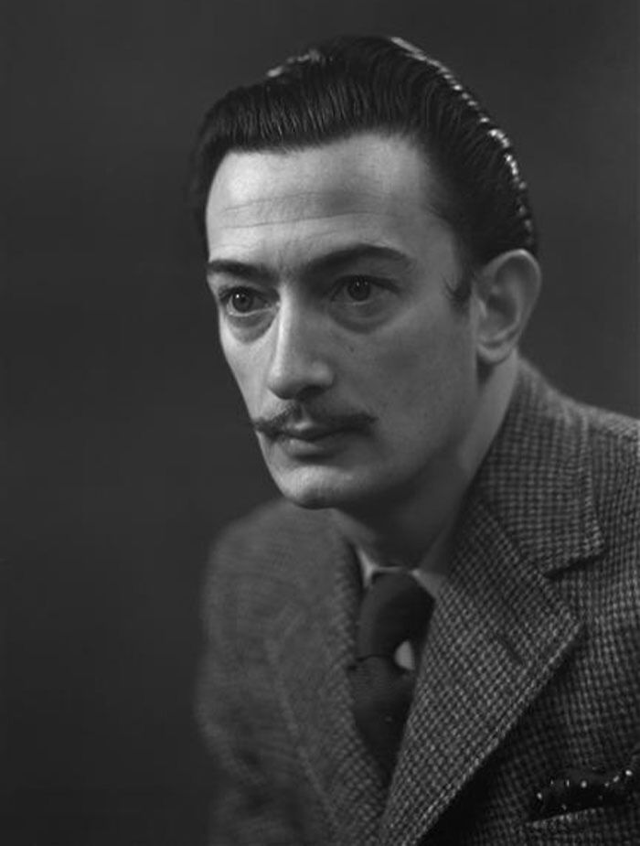 Black and white portrait of Salvador Dali by Studio Harcourt in 1936, illustrating curious facts in art classes.