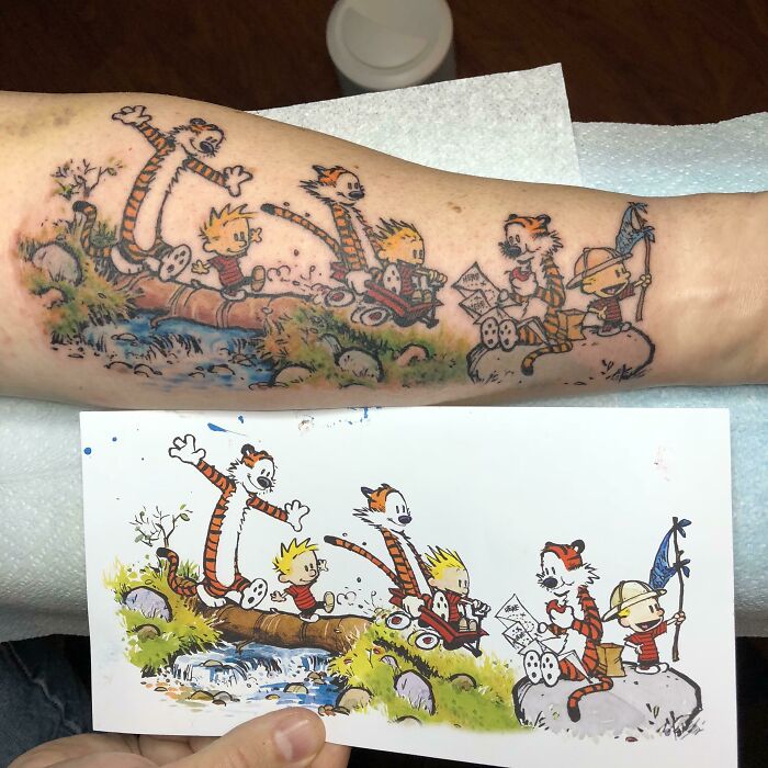 Cartoon tattoos featuring Calvin and Hobbes in various playful activities for a nostalgic touch.