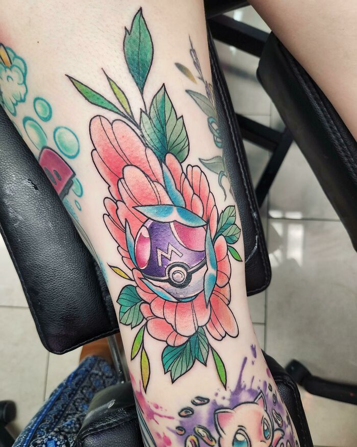 Cartoon tattoo featuring a colorful floral design with a purple sphere, inspired by animated shows.