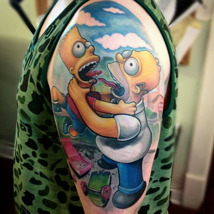 Cartoon tattoo on an arm featuring two animated characters in a playful scene, evoking childhood favorites.