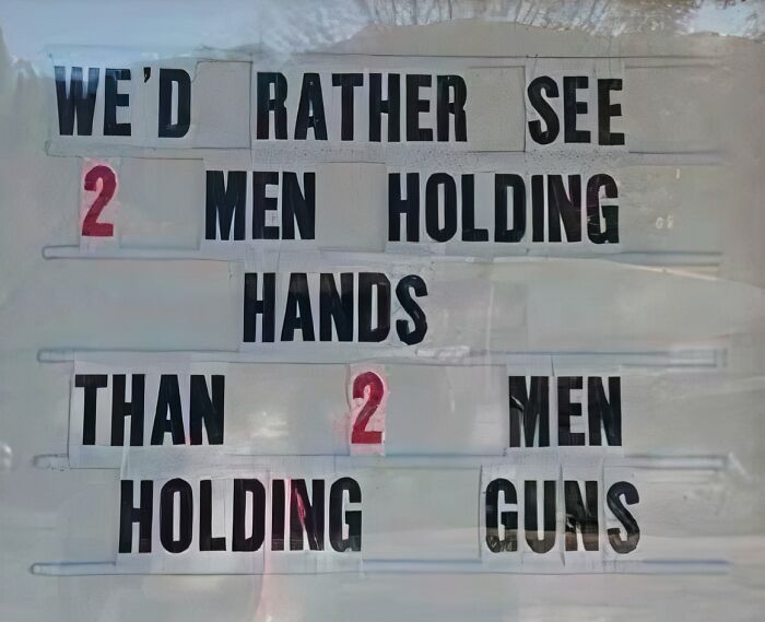 Funny church sign about 2 men holding hands