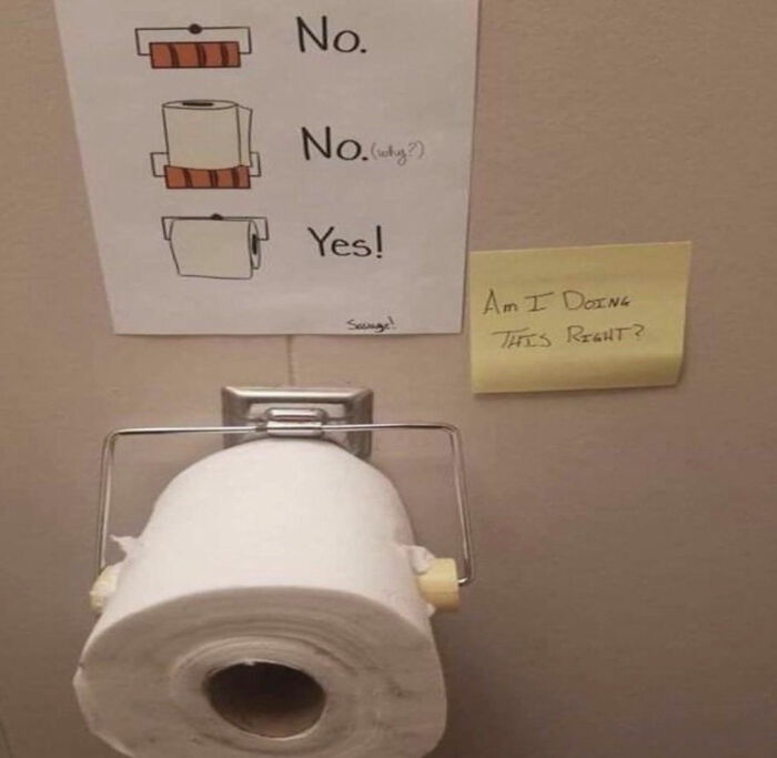Roll of toilet paper placed incorrectly on holder with a sign questioning instructions and illustrating common hilarious mishaps.