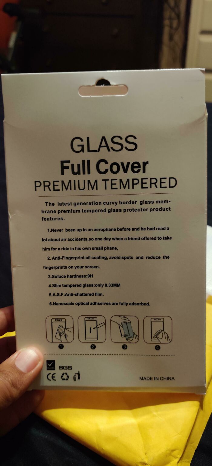 Packaging for a tempered glass screen protector with confusing instructions illustrating a common failure to understand instructions.