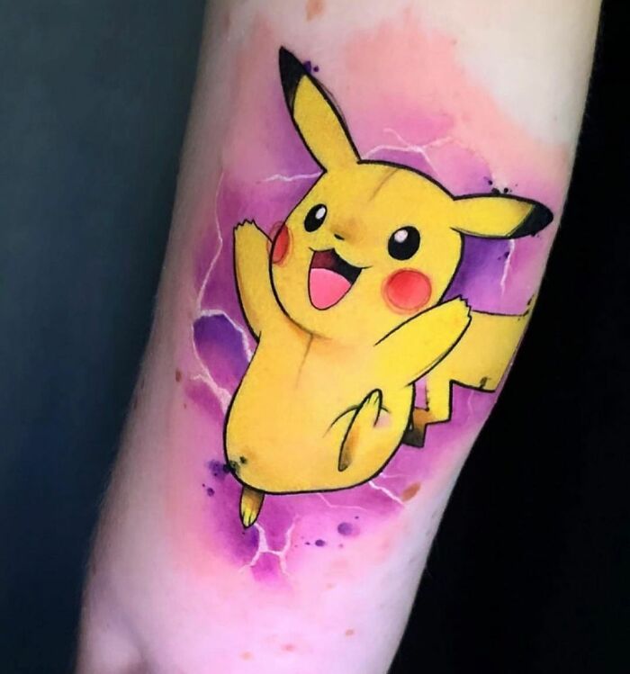 Cartoon tattoo of a popular yellow character from childhood on an arm, with a pink and purple background.