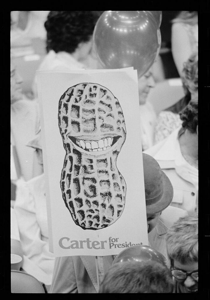 A Sign Featuring A Grinning Peanut Is Held Up By A Jimmy Carter Supporter At The 1976 Democratic National Convention