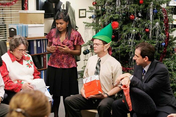 The Office characters opening the presents 