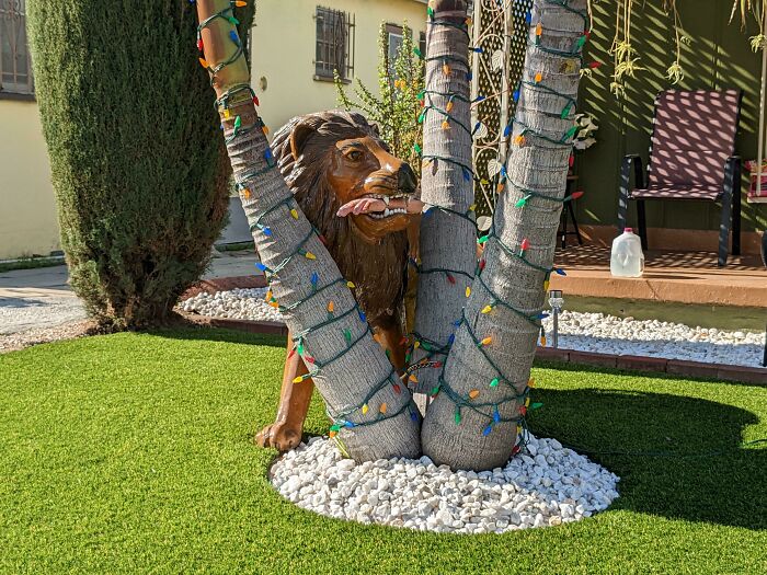 My Neighbors Put A Man-Eating Lion Statue In Their Front Yard For Christmas
