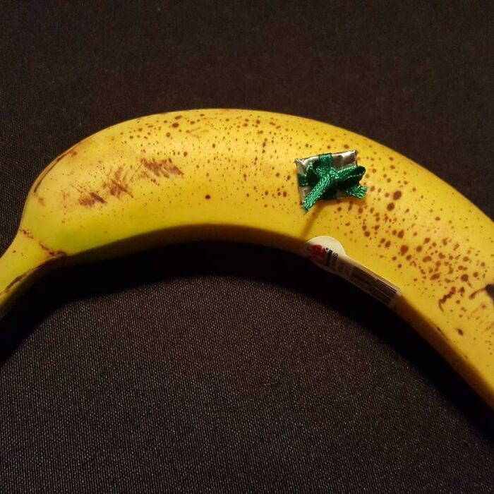 My Kid Has An Unhealthy Obsession With Who Got The "Biggest" Present. Gift Wrapped 32gb Microsd Card. Banana For Scale