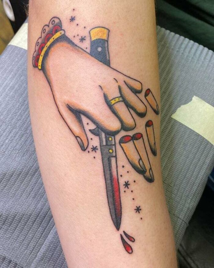 Psychedelic art tattoo featuring a stylized hand holding a knife, designed on a forearm.