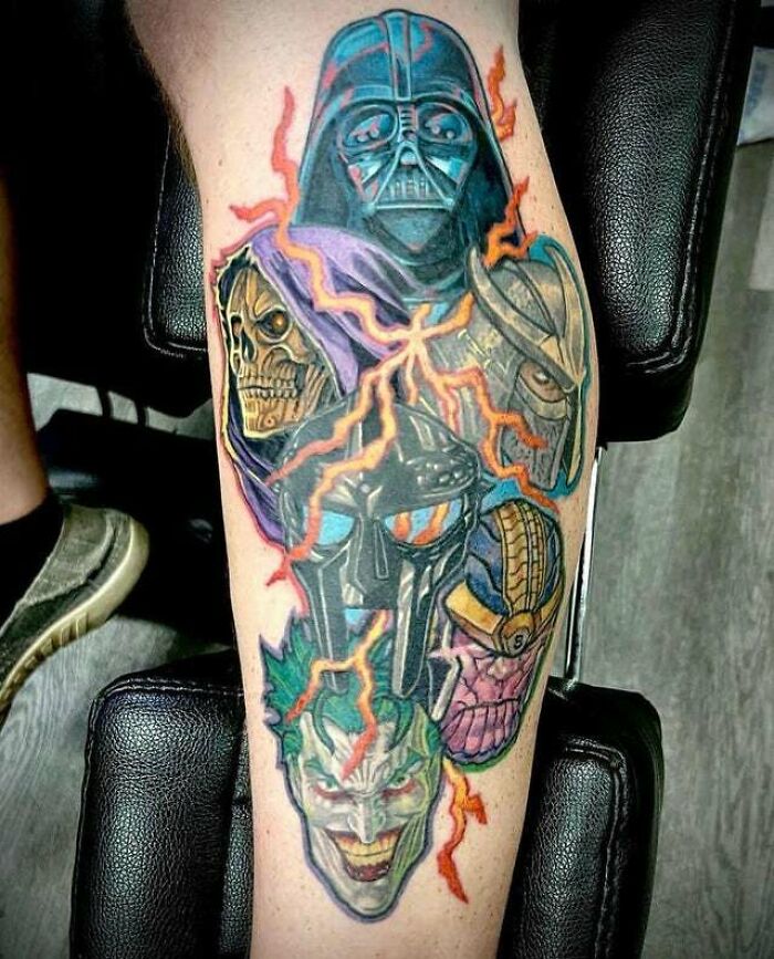 Psychedelic art tattoo featuring iconic villain faces with vibrant colors and electric effects on a person's leg.