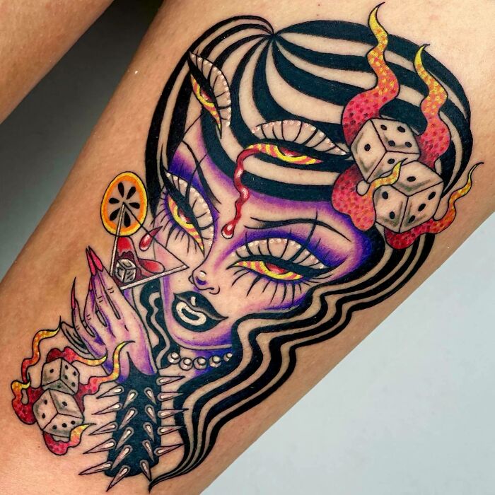 Colorful trippy tattoo of a surreal woman with dice and a cocktail, featuring bold lines and vivid details.