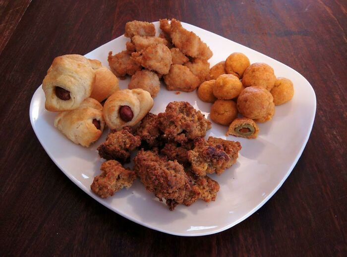 Christmas Morning Feast: Cheese And Olive Balls, Cheese And Sausage Balls, Pigs In Blankets, And Chick-Fil-A Chicken Nuggets