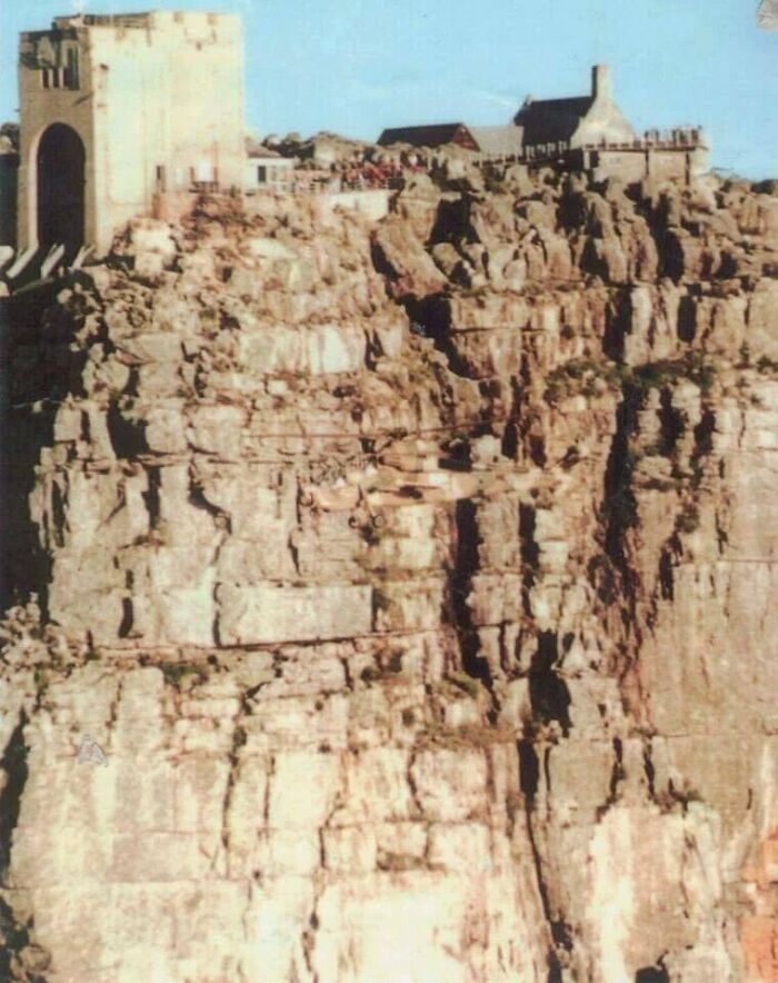 Rock cliff with camouflaged person blending into the rocky background, showcasing perfectly camouflaged things to find.