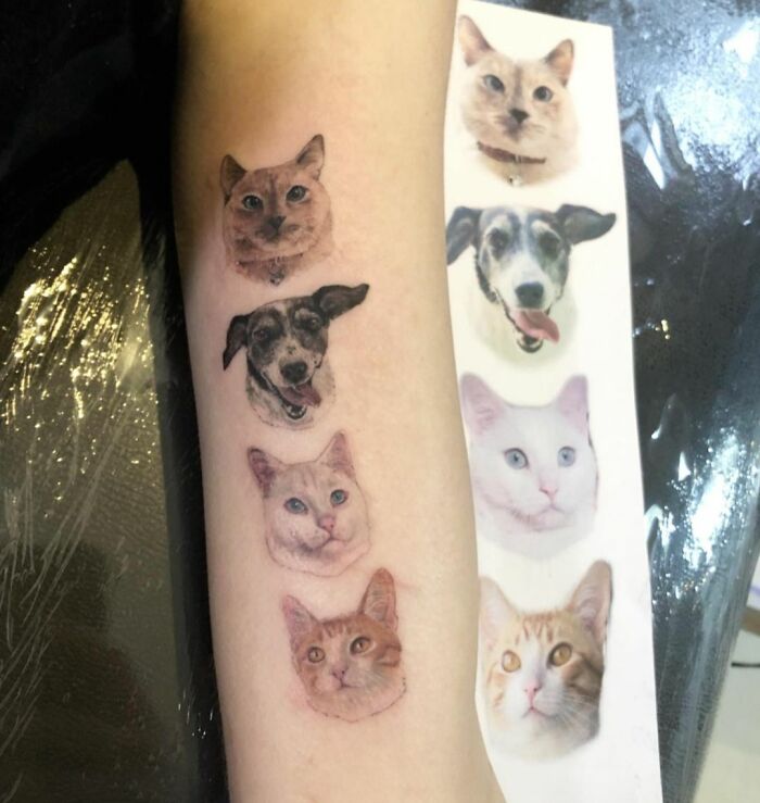 Pet tattoos on arm depicting cats and dogs, celebrating furry friends.