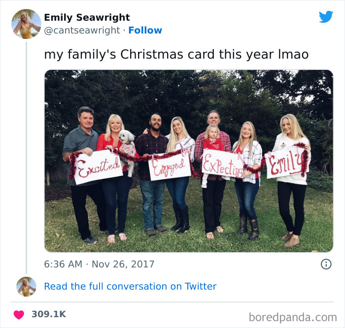 Family holding humorous Christmas cards with messages for friends and family.