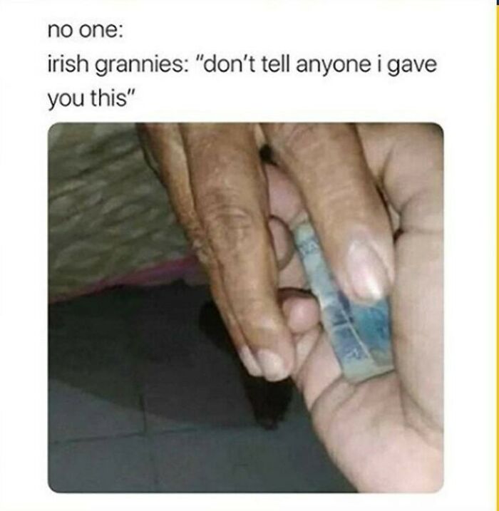 Hands exchanging a folded banknote, highlighting a humorous moment about Irish grannies in Ireland culture.