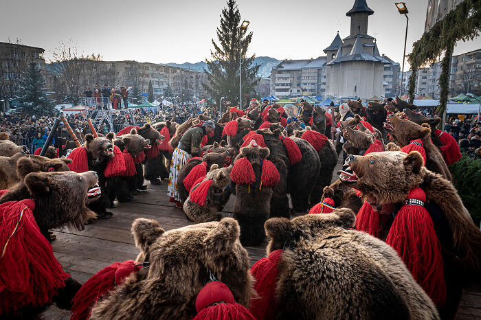 Crowd watching a traditional bear dance performance captured in nature photographer of the year winning pictures 2022.