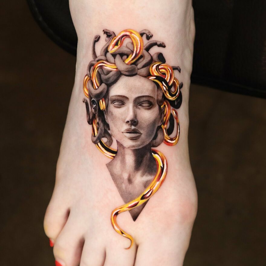 Golden Medusa tattoo with intricate details designed by a Manhattan-based tattoo artist.