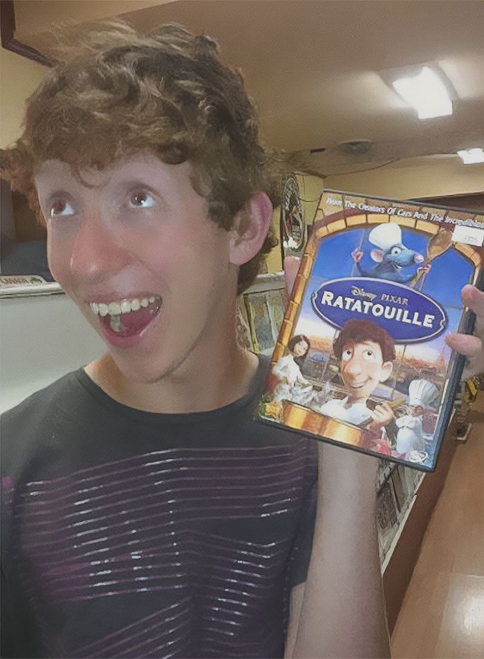 Person holding a DVD of Ratatouille