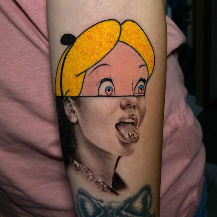 Cartoon tattoo blending a girl's face with a classic animated character, evoking childhood favorites.