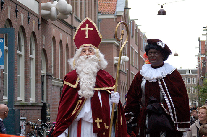 Persons wearing outfits and celebrating Sinterklaas