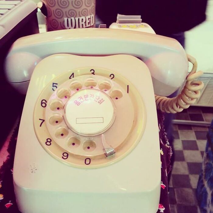 Vintage rotary telephone on a table, symbolizing the most Gen X thing and memories from the past.