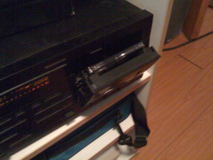 Vintage VCR playing a tape, capturing nostalgic Gen X technology and memories from past decades.