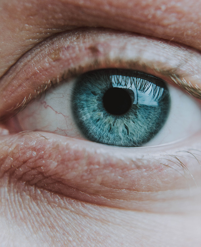 Close-up of a blue eye representing doctors sharing their craziest second opinion stories in medical care.
