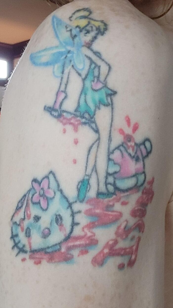 Funny bad tattoo showing a fairy with pastel colors, surrounded by cartoon characters and colorful design.