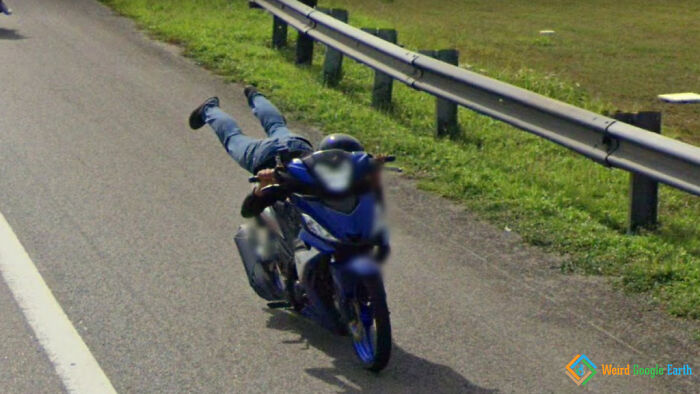 "Motorcycle Gymnastics". Location: Pagoh, Malaysia