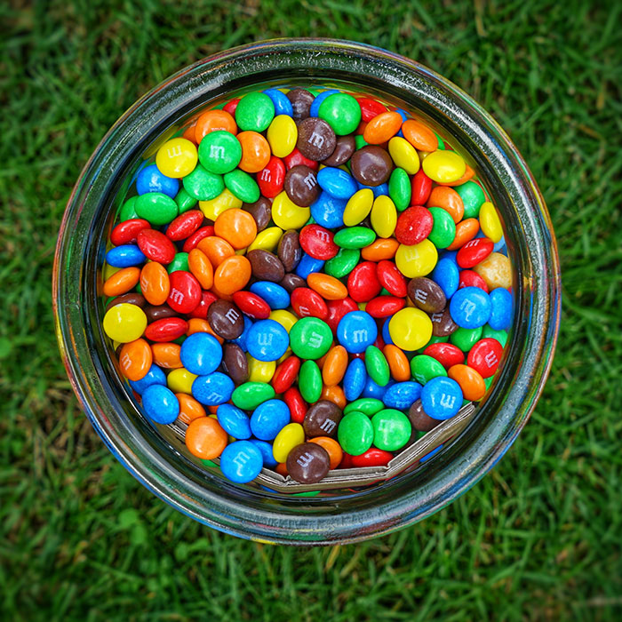 Rainbow M&Ms in one cup