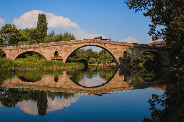 Kadin bridge with river and forest near