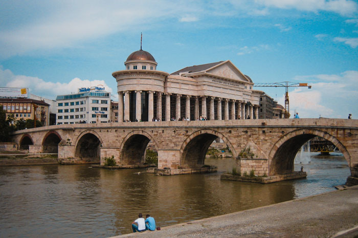 Stone bridge with river and buildings