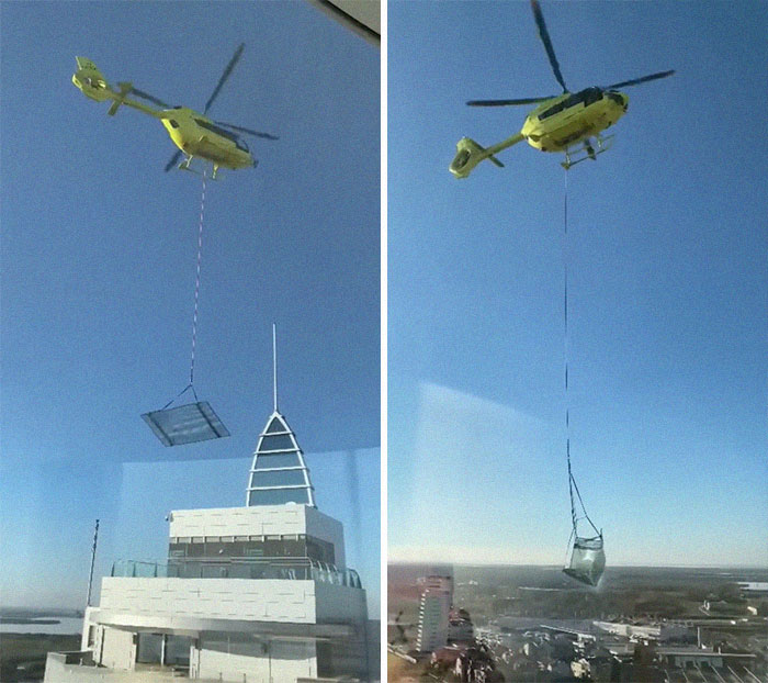 Transporting A Big Glass Panel By Helicopter