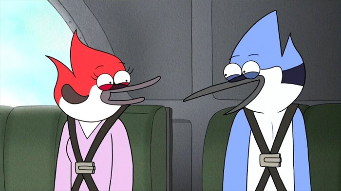 Cartoon couple wearing seatbelts, sitting together with joyful expressions.