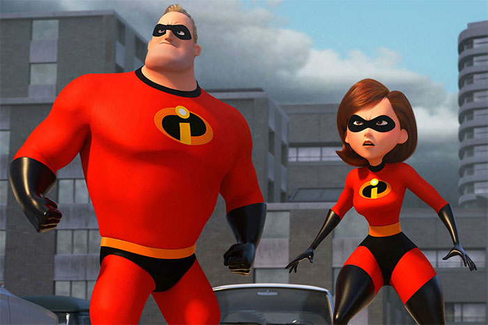 Cartoon couple in superhero outfits stand ready in a city setting.