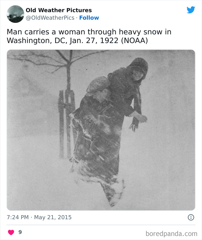 Man carrying woman through heavy snowstorm in Washington DC, an extreme and crazy weather example from the past.