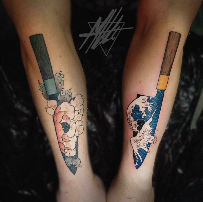 Beautiful tattoo idea of knives on forearms, featuring floral and ocean wave designs executed perfectly.