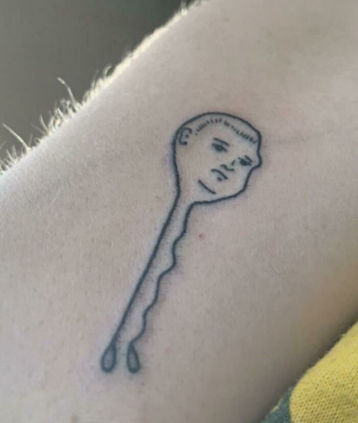 Unique tattoo of a bobby pin with a face, illustrating a beautifully executed tattoo idea.