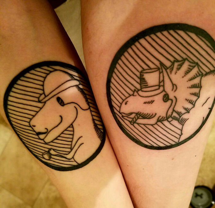 Brother and sister tattoos featuring dinosaurs in hats, emphasizing unique and connected designs.